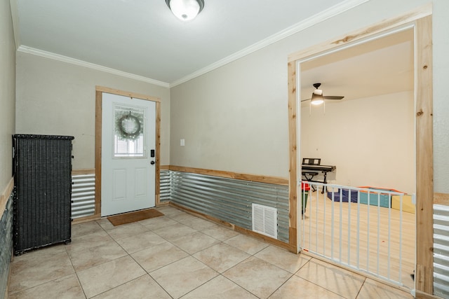9390 Adams St, Terrell, TX 75160 - foyer entrance featuring ornamental molding, ceiling fan, and tile patterned floors