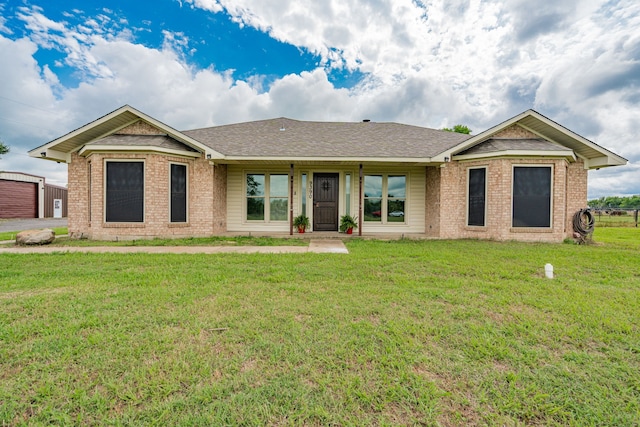 9390 Adams St, Terrell, TX 75160 - ranch-style home featuring a front lawn, brick siding, and roof with shingles