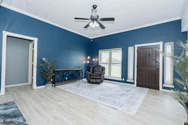 9390 Adams St, Terrell, TX 75160 - living area with wood finished floors, ornamental molding, ceiling fan, and baseboards