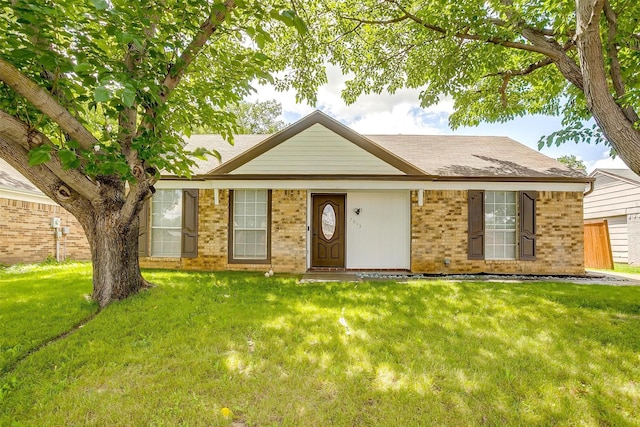 7013 Buttonwood Dr, Fort Worth, TX 76137 - single story home featuring brick siding, a front lawn, and roof with shingles