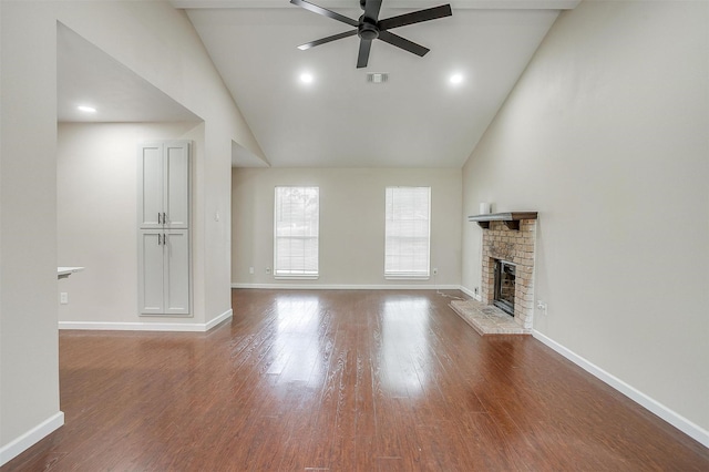 7013 Buttonwood Dr, Fort Worth, TX 76137 - unfurnished living room featuring ceiling fan, high vaulted ceiling, a glass covered fireplace, wood finished floors, and baseboards