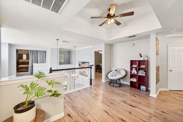 4710 Safe Harbour Dr, Arlington, TX 76016 - sitting room with ceiling fan, wood finished floors, a raised ceiling, baseboards, and attic access