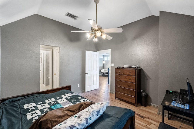 4710 Safe Harbour Dr, Arlington, TX 76016 - bedroom featuring vaulted ceiling, light wood-style flooring, a textured wall, and a ceiling fan