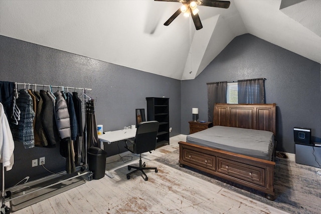 4710 Safe Harbour Dr, Arlington, TX 76016 - bedroom with a textured wall, wood finished floors, lofted ceiling, a desk, and a ceiling fan