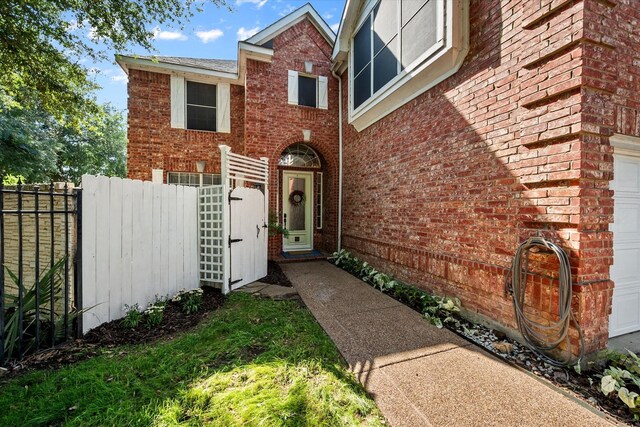 4710 Safe Harbour Dr, Arlington, TX 76016 - doorway to property with brick siding and a garage