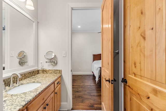 12265 Sable Ln, Whitehouse, TX 75791 - ensuite bathroom with vanity, wood finished floors, baseboards, and crown molding