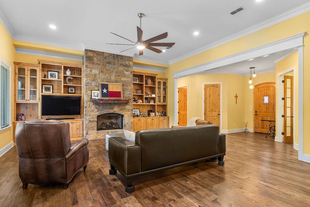 12265 Sable Ln, Whitehouse, TX 75791 - living room featuring a ceiling fan, ornamental molding, dark wood-style flooring, a fireplace, and baseboards