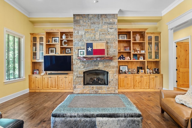 12265 Sable Ln, Whitehouse, TX 75791 - living room featuring ornamental molding, a stone fireplace, wood-type flooring, and baseboards