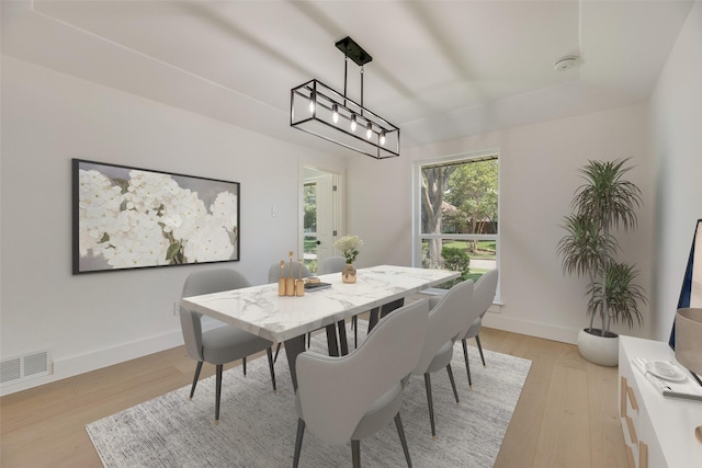 3620 Big Horn Trl, Plano, TX 75075 - dining room featuring light wood-style floors and baseboards