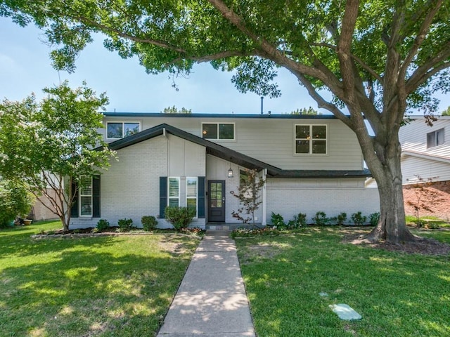 1135 La Mesa Dr, Richardson, TX 75080 - view of front facade with brick siding and a front lawn