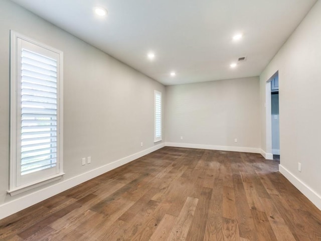 1135 La Mesa Dr, Richardson, TX 75080 - unfurnished room with baseboards, wood finished floors, and recessed lighting