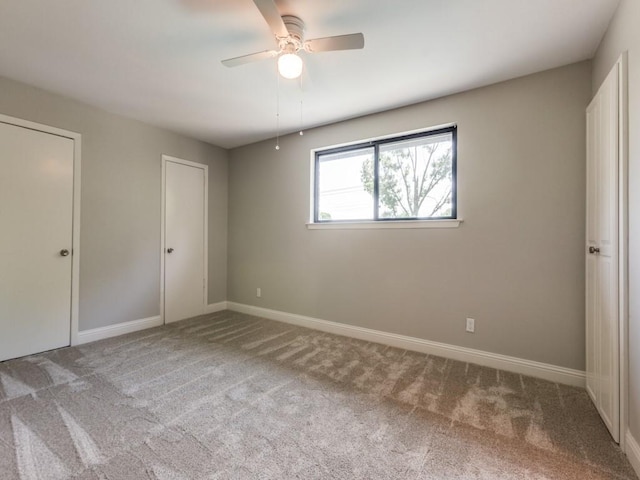 1135 La Mesa Dr, Richardson, TX 75080 - unfurnished bedroom featuring carpet, baseboards, and a ceiling fan