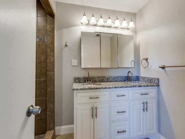 1135 La Mesa Dr, Richardson, TX 75080 - bathroom with double vanity and tiled shower