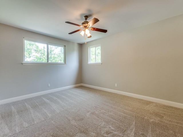 1135 La Mesa Dr, Richardson, TX 75080 - empty room with light carpet, baseboards, and ceiling fan