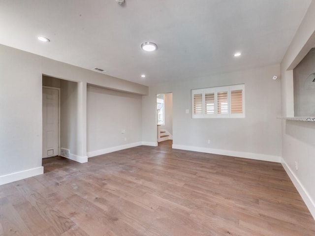 1135 La Mesa Dr, Richardson, TX 75080 - empty room featuring wood finished floors, baseboards, stairs, and recessed lighting