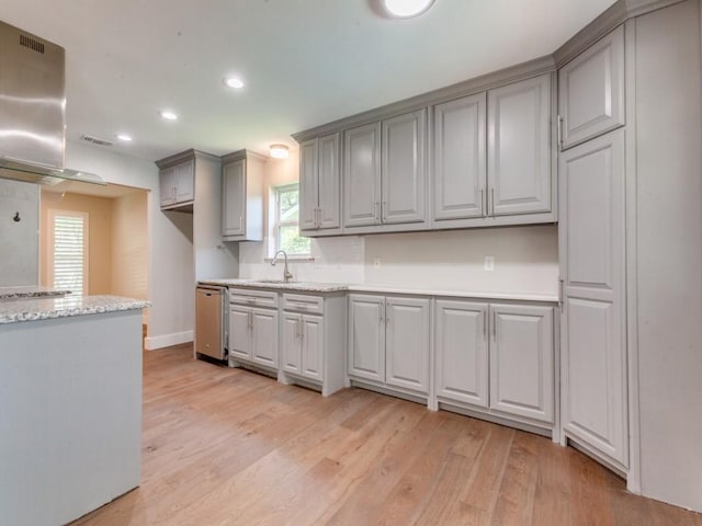 1135 La Mesa Dr, Richardson, TX 75080 - kitchen with light wood finished floors, gray cabinets, recessed lighting, baseboards, and a sink