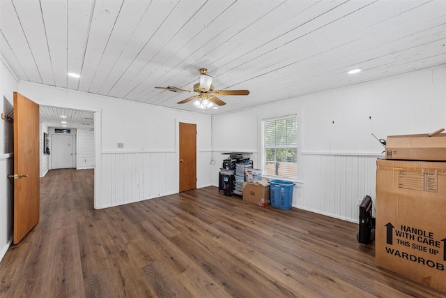 281 Private Road 612, Reagan, TX 76680 - unfurnished living room with a wainscoted wall, wooden ceiling, a ceiling fan, and wood finished floors