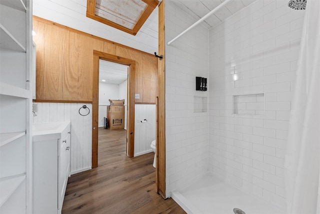 281 Private Road 612, Reagan, TX 76680 - full bath featuring wooden walls, vanity, a tile shower, and wood finished floors