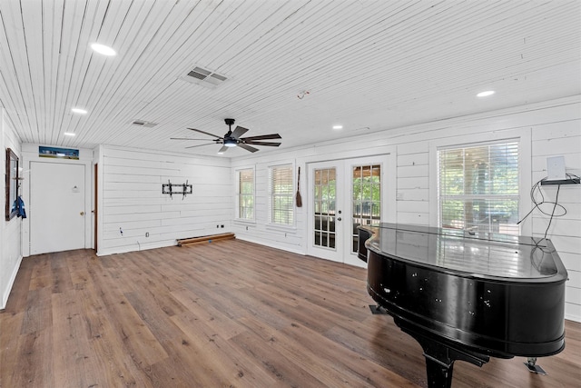 281 Private Road 612, Reagan, TX 76680 - living area with french doors, a ceiling fan, wood finished floors, recessed lighting, and wooden walls