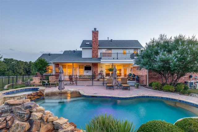 5891 Harmony Ranch Rd, Aubrey, TX 76227 - view of swimming pool featuring a patio and a pool with connected hot tub
