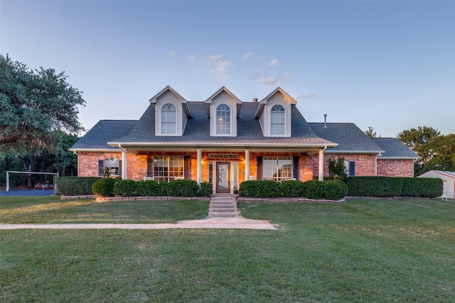 5891 Harmony Ranch Rd, Aubrey, TX 76227 - new england style home featuring brick siding and a front lawn
