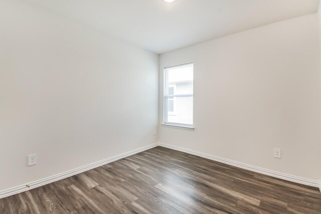 467 Bobbie St, Mabank, TX 75147 - spare room featuring dark wood-style flooring and baseboards