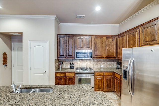 5321 Locust Dr, Mckinney, TX 75070 - kitchen with appliances with stainless steel finishes, crown molding, light stone counters, backsplash, and a sink