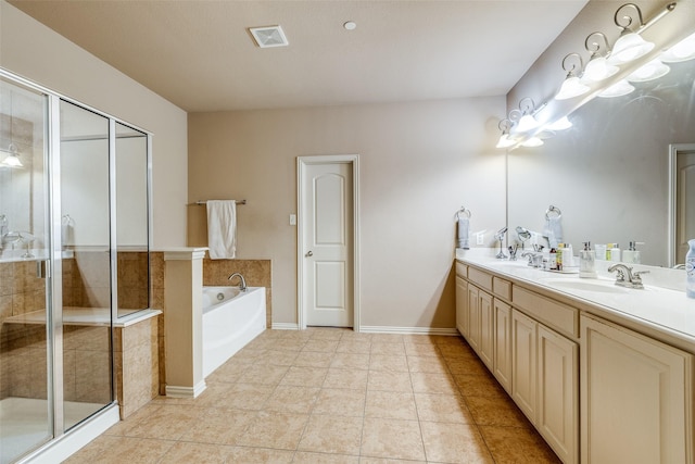 5321 Locust Dr, Mckinney, TX 75070 - bathroom featuring double vanity, a bath, a stall shower, tile patterned floors, and baseboards