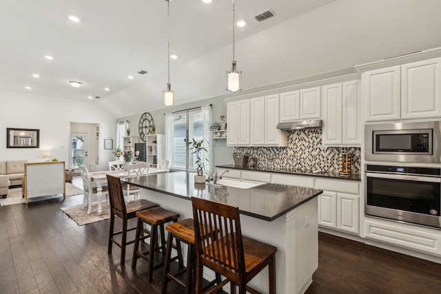 2516 Stella Ln, Northlake, TX 76247 - kitchen with stainless steel appliances, dark countertops, vaulted ceiling, backsplash, and open floor plan