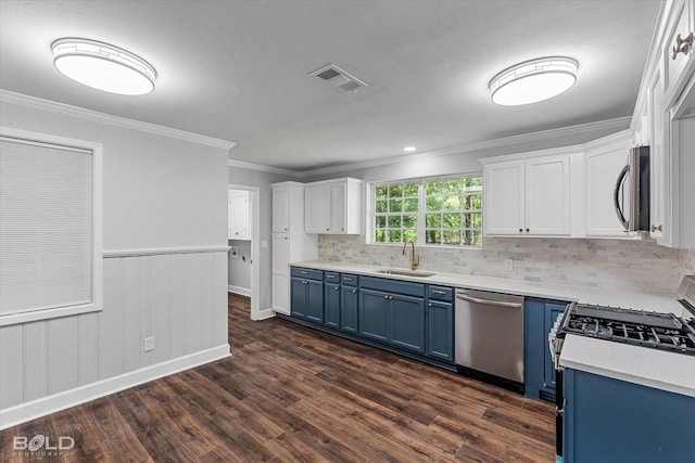 6130 Yarbrough Rd, Shreveport, LA 71119 - kitchen featuring blue cabinetry, stainless steel appliances, a sink, dark wood-style floors, and white cabinetry
