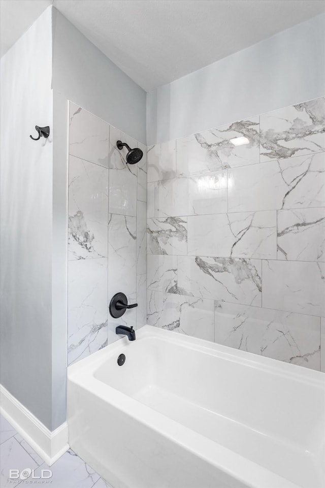 6130 Yarbrough Rd, Shreveport, LA 71119 - full bath featuring marble look tile flooring, tub / shower combination, and baseboards