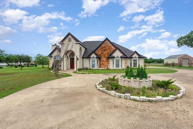 624 Horseshoe Bnd, Royse City, TX 75189 - french country home featuring curved driveway and a front lawn