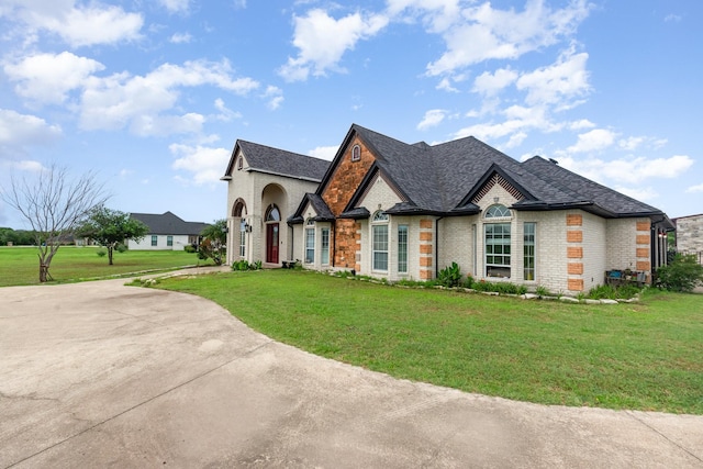624 Horseshoe Bnd, Royse City, TX 75189 - french country home featuring brick siding, a front lawn, and a shingled roof
