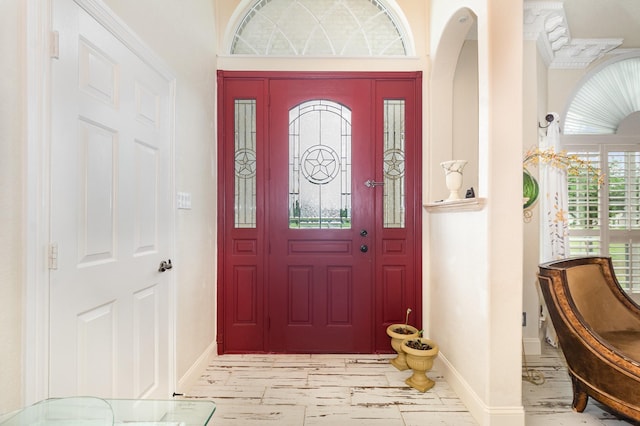 624 Horseshoe Bnd, Royse City, TX 75189 - entrance foyer featuring baseboards, marble look tile flooring, and arched walkways