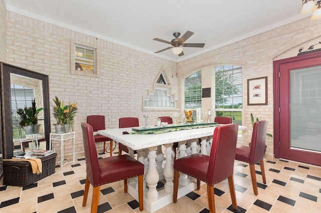 624 Horseshoe Bnd, Royse City, TX 75189 - dining area featuring ceiling fan, brick wall, and ornamental molding