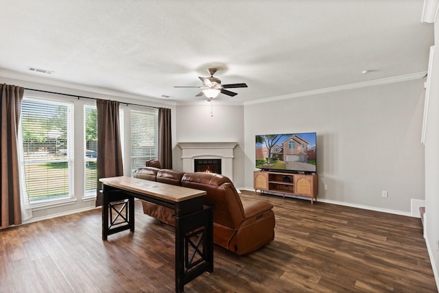 3148 Guadaloupe, Grand Prairie, TX 75054 - living room featuring a lit fireplace, dark wood-style flooring, a ceiling fan, baseboards, and ornamental molding