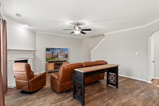 3148 Guadaloupe, Grand Prairie, TX 75054 - living room with arched walkways, a ceiling fan, wood finished floors, ornamental molding, and baseboards