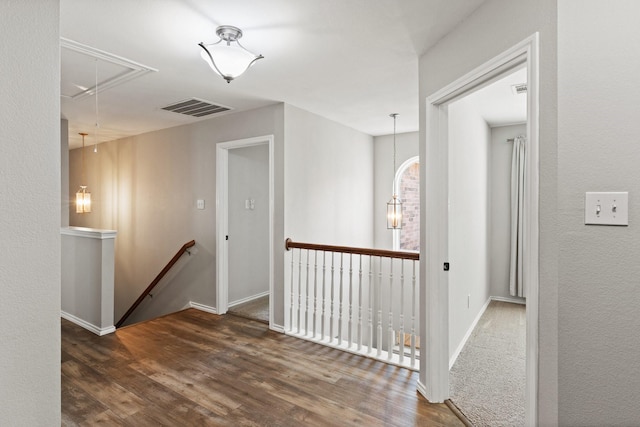 3148 Guadaloupe, Grand Prairie, TX 75054 - hallway featuring attic access, an upstairs landing, wood finished floors, and baseboards