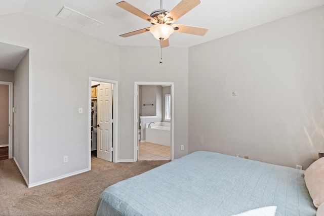 3148 Guadaloupe, Grand Prairie, TX 75054 - bedroom featuring light colored carpet, a walk in closet, baseboards, connected bathroom, and ceiling fan