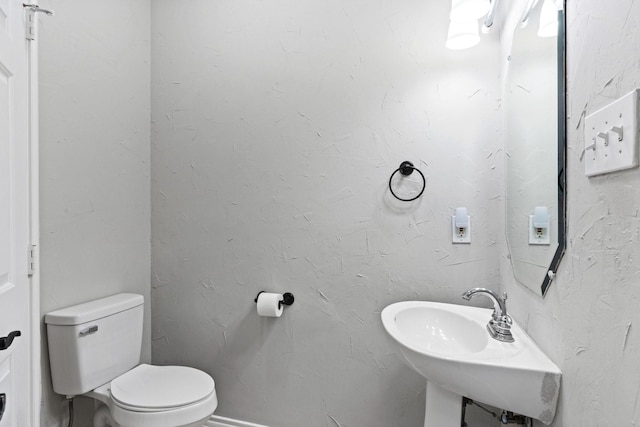 3148 Guadaloupe, Grand Prairie, TX 75054 - bathroom with toilet and a sink