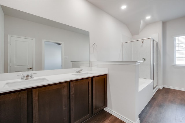 2112 Steer Creek Pl, Mesquite, TX 75149 - full bathroom featuring a shower stall, wood finished floors, double vanity, baseboards, and recessed lighting
