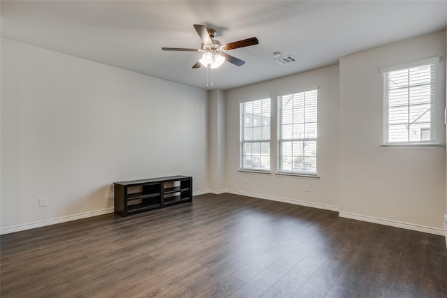 2112 Steer Creek Pl, Mesquite, TX 75149 - empty room with a ceiling fan, dark wood-style flooring, and baseboards