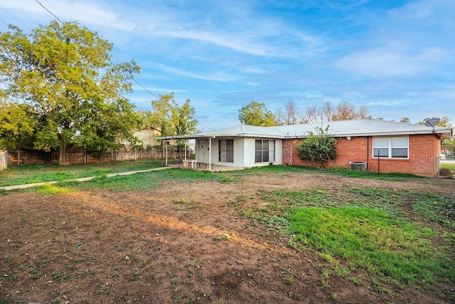403 W China St, Brady, TX 76825 - back of property with brick siding and central air condition unit