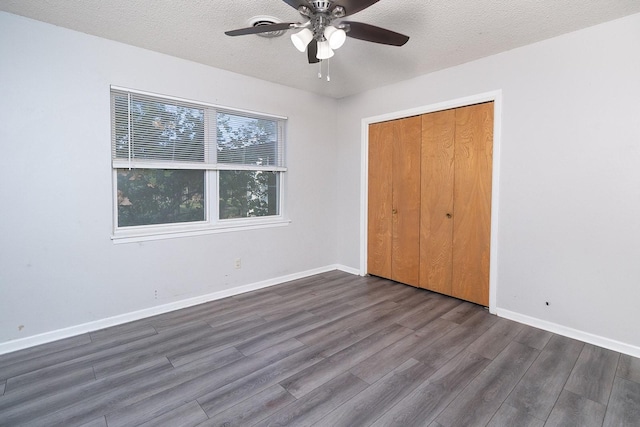 403 W China St, Brady, TX 76825 - unfurnished bedroom featuring wood finished floors, baseboards, a textured ceiling, a closet, and ceiling fan
