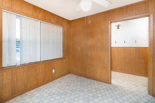 403 W China St, Brady, TX 76825 - spare room featuring wooden walls and ceiling fan