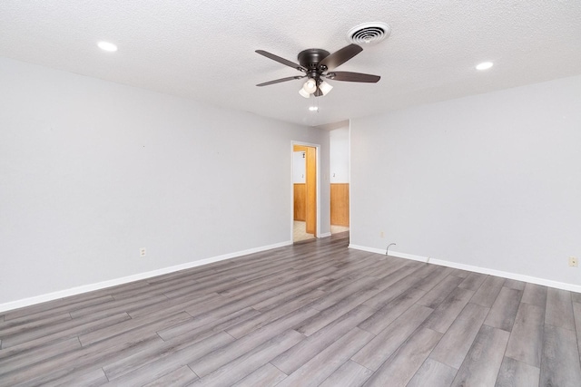 403 W China St, Brady, TX 76825 - unfurnished room featuring a ceiling fan, wood finished floors, recessed lighting, baseboards, and a textured ceiling