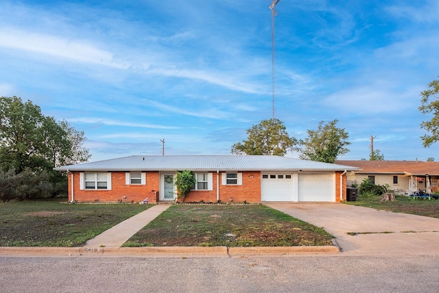 403 W China St, Brady, TX 76825 - single story home with a garage, driveway, brick siding, and a front lawn
