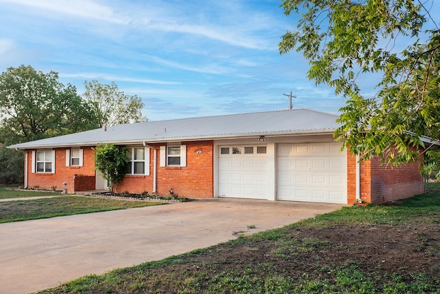 403 W China St, Brady, TX 76825 - single story home with an attached garage, concrete driveway, brick siding, and metal roof