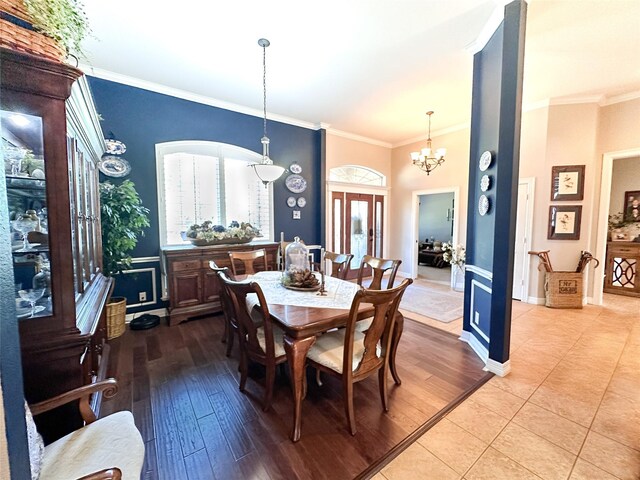 599 N Weldon, Frankston, TX 75763 - dining space with ornamental molding, a chandelier, wood finished floors, and baseboards