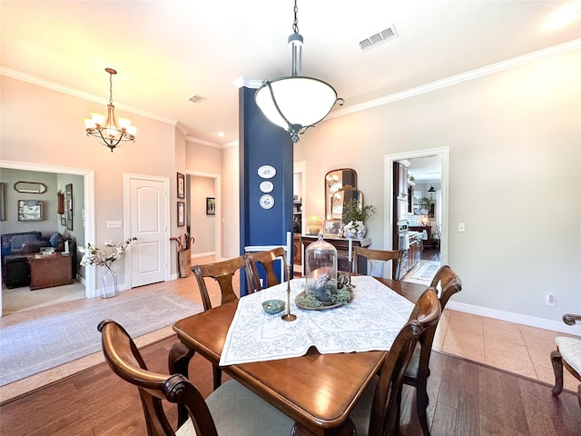 599 N Weldon, Frankston, TX 75763 - dining space featuring ornamental molding, a chandelier, tile patterned floors, and baseboards